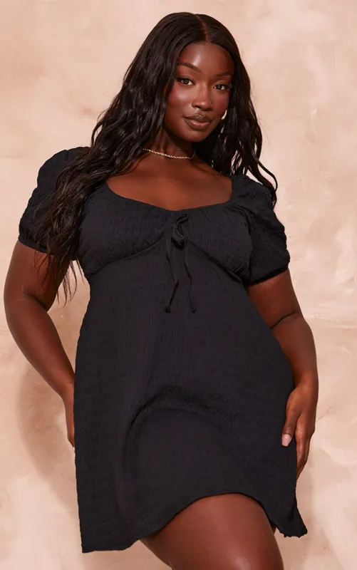 Plus Black Puff Sleeve Textured Shift Dress sold by Pretty Little Thing
