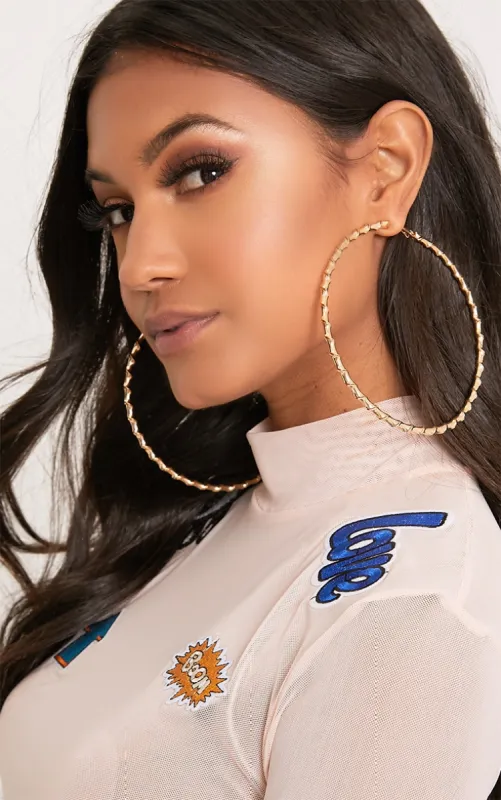 Brynn Gold Big Twisted Metal Hoop Earrings sold by Pretty Little Thing