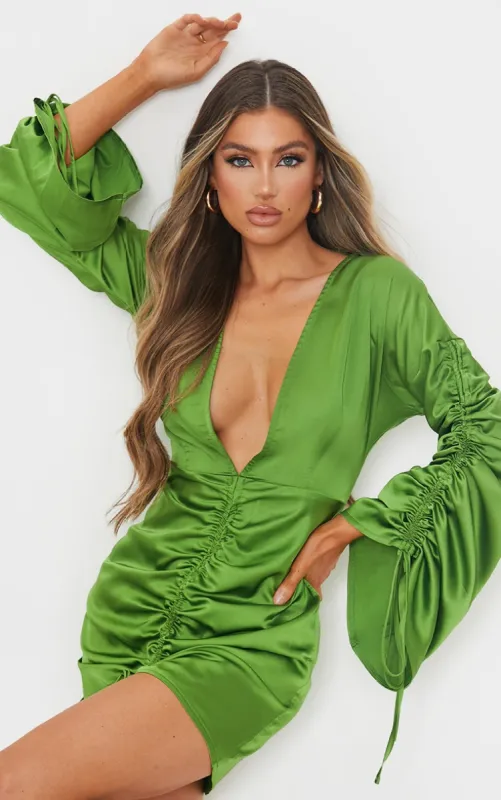 Olive Satin Plunge Ruched Front Bodycon Dress sold by Pretty Little Thing