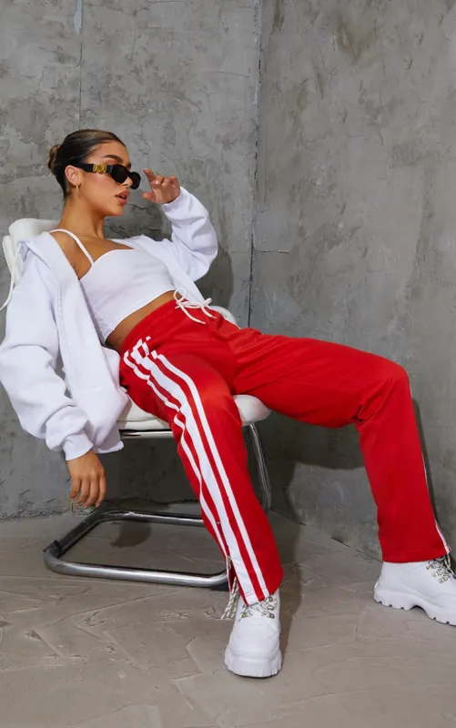 Red Zip Side Stripe Wide Leg Joggers sold by Pretty Little Thing