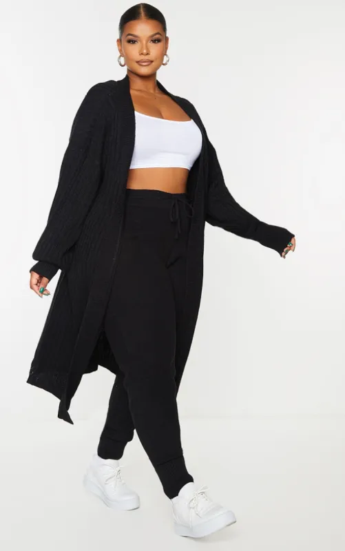 Plus Black Ribbed Knit Midi Cardigan sold by Pretty Little Thing