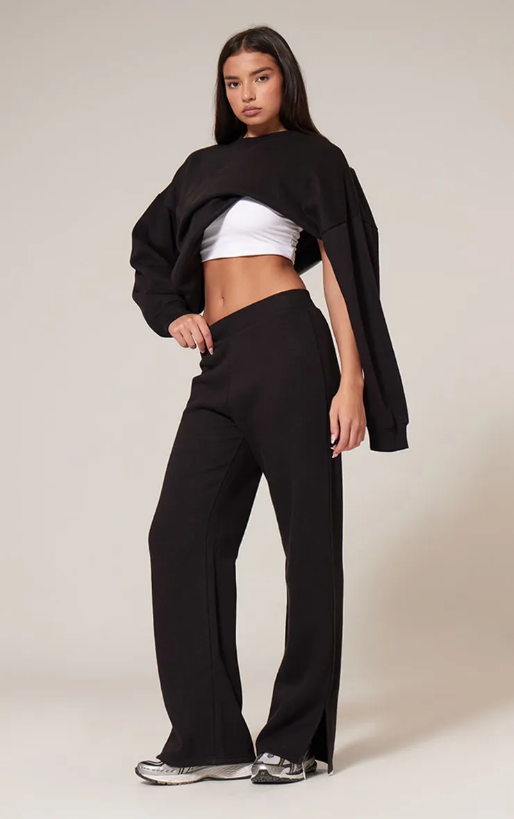 Black Flared Split Hem Joggers sold by Pretty Little Thing