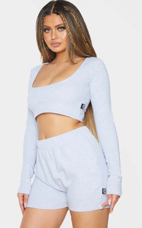 PRETTYLITTLETHING Grey Marl Badge Cotton Long Sleeve Crop Top sold by Pretty Little Thing