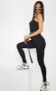 Black Basic Strappy Jumpsuit sold by Pretty Little Thing