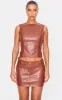 Chocolate Faux Leather Low Rise Mini Skirt sold by Pretty Little Thing