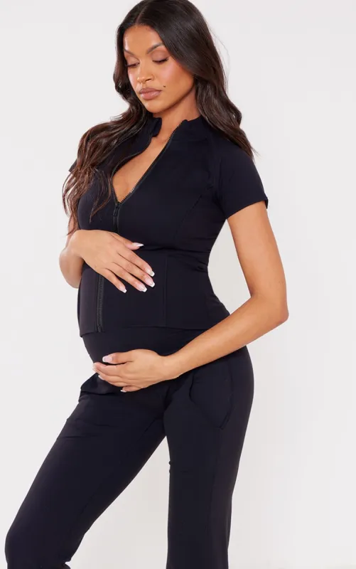 Maternity Black Contour Sculpt Short Sleeve Zip Up Top sold by Pretty Little Thing