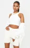 White Stretch Slinky Racer Crop Top sold by Pretty Little Thing
