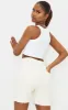 White Stretch Slinky Racer Crop Top sold by Pretty Little Thing
