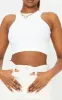 White Stretch Slinky Racer Crop Top sold by Pretty Little Thing