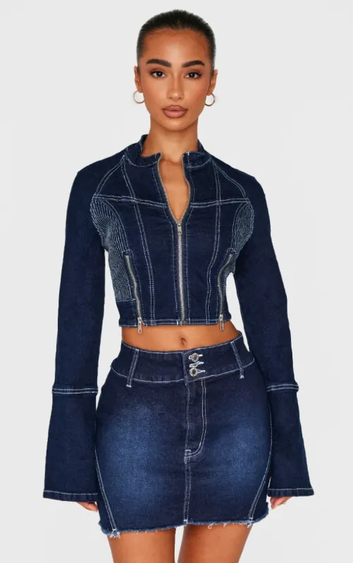 Petite Indigo Stitch Detail Zip Cropped Denim Jacket sold by Pretty Little Thing