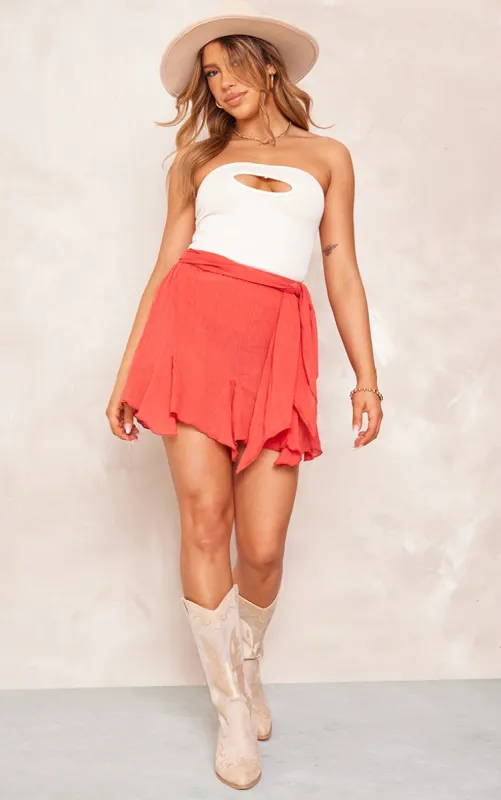 Rust Cheesecloth Handkerchief Hem Tie Waist Mini Skirt sold by Pretty Little Thing