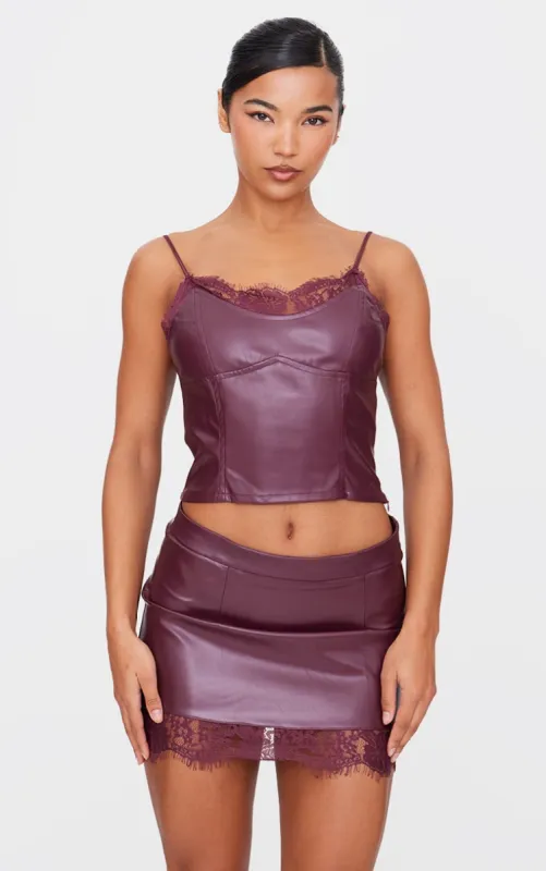 Burgundy Matte Faux Leather Lace Trim Cami Top sold by Pretty Little Thing