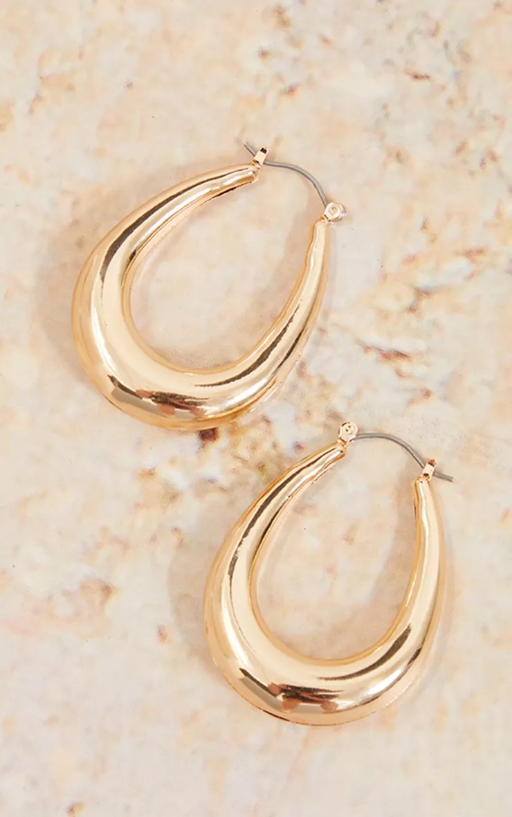 Gold Rounded Oval Hoop Earrings sold by Pretty Little Thing product image thumbnail 2