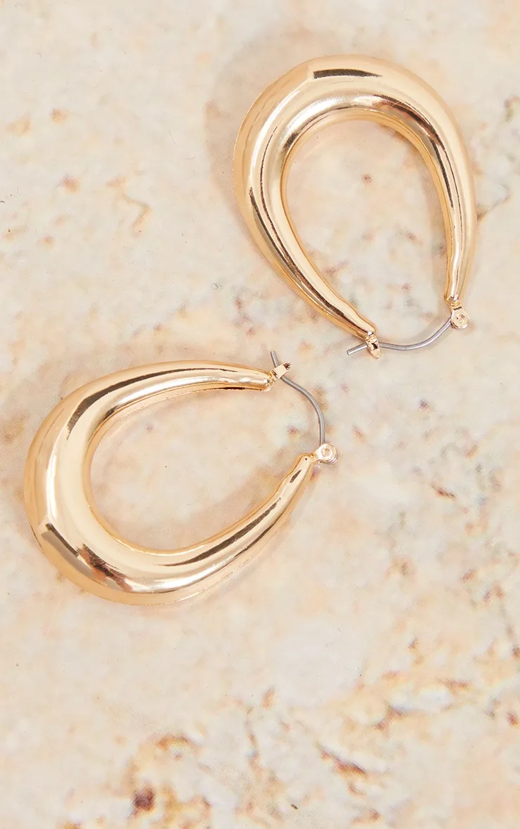 Gold Rounded Oval Hoop Earrings sold by Pretty Little Thing product image thumbnail 3