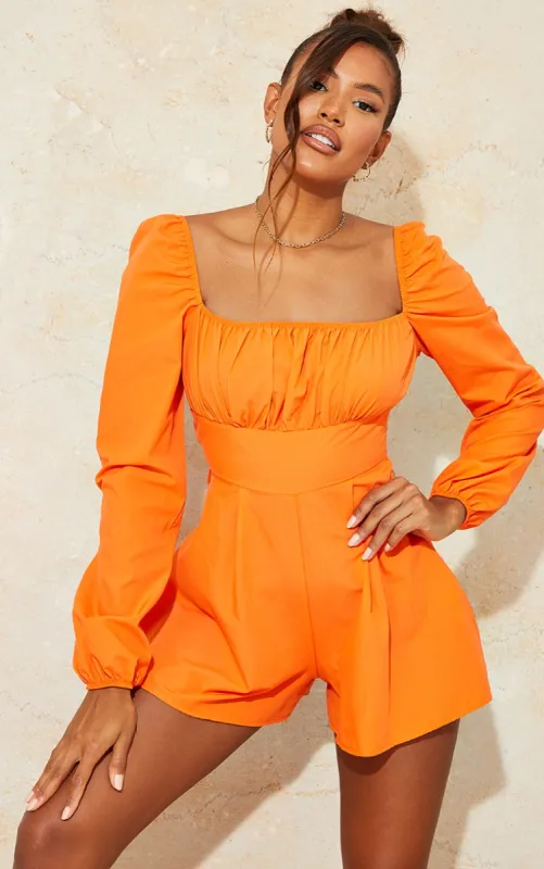 Bright Orange Tie Back Long Sleeve Playsuit sold by Pretty Little Thing