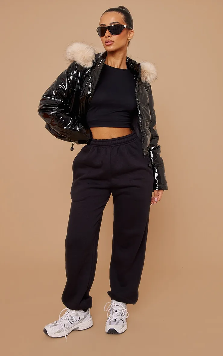 Petite Black Vinyl Faux Fur Hood Puffer Jacket sold by Pretty Little Thing