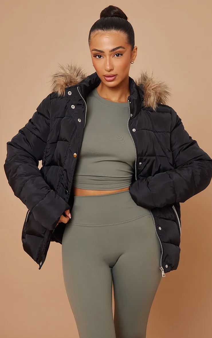 Petite Black Faux Fur Hood Puffer Jacket sold by Pretty Little Thing