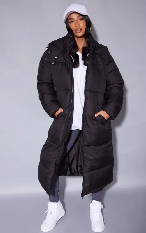 Petite Black Long Puffer Coat sold by Pretty Little Thing