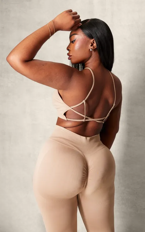 PLT SPORT Plus Light Mocha Seamless Halterneck Open Back Sports Bra sold by Pretty Little Thing