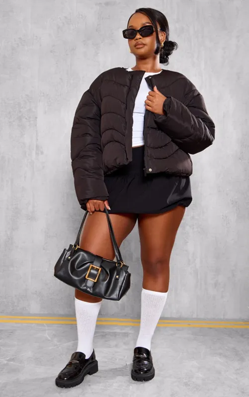Plus Black Cropped Round Neck Puffer Jacket sold by Pretty Little Thing