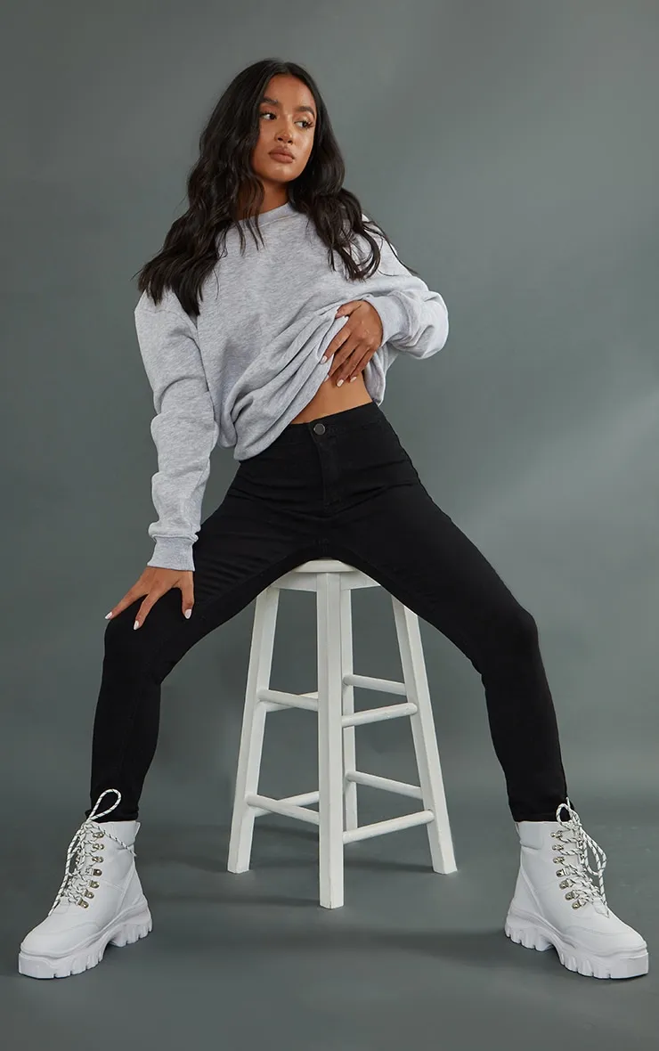 Petite Black High Rise Skinny Jeans sold by Pretty Little Thing