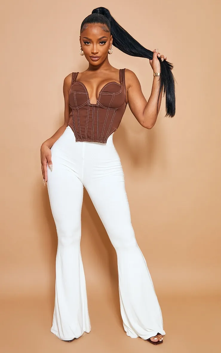 Shape White Slinky Flared Trousers sold by Pretty Little Thing