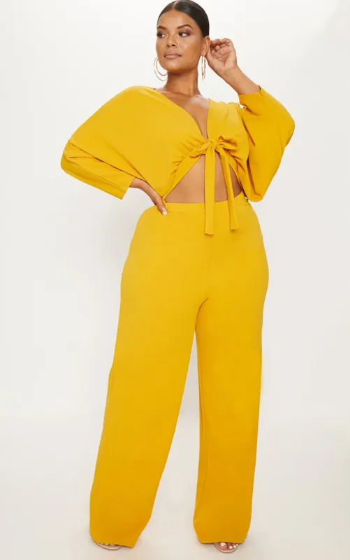 Plus Mustard Crepe Batwing Cut Out Jumpsuit sold by Pretty Little Thing