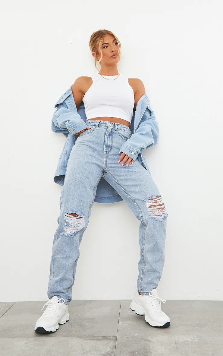 PRETTYLITTLETHING Light Blue Wash Knee Rip Mom Jeans sold by Pretty Little Thing