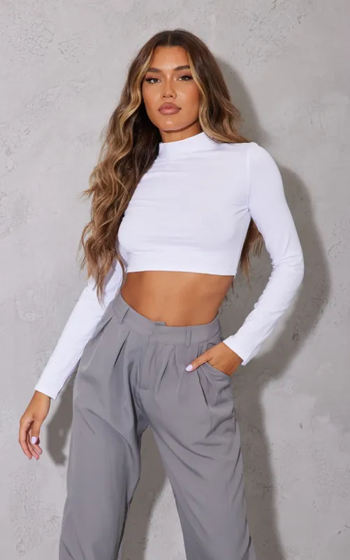 White High Neck Long Sleeve Crop Top sold by Pretty Little Thing