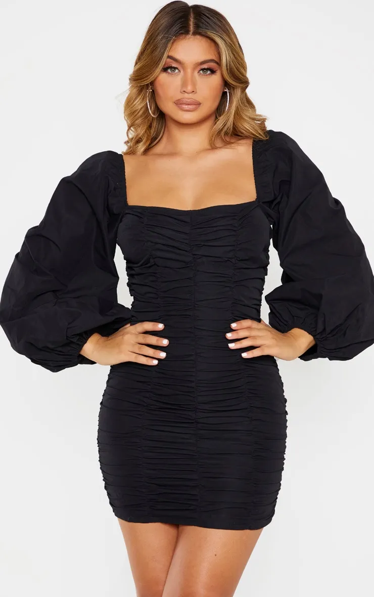 Black Balloon Sleeve Ruched Bodycon Dress sold by Pretty Little Thing