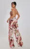 Multi Floral Print Halterneck Wide Leg Jumpsuit sold by Pretty Little Thing