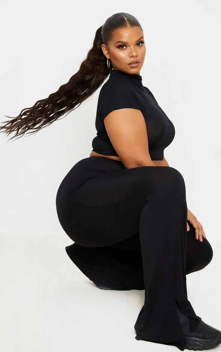 Plus Black Jersey Split Hem Flared Trousers sold by Pretty Little Thing