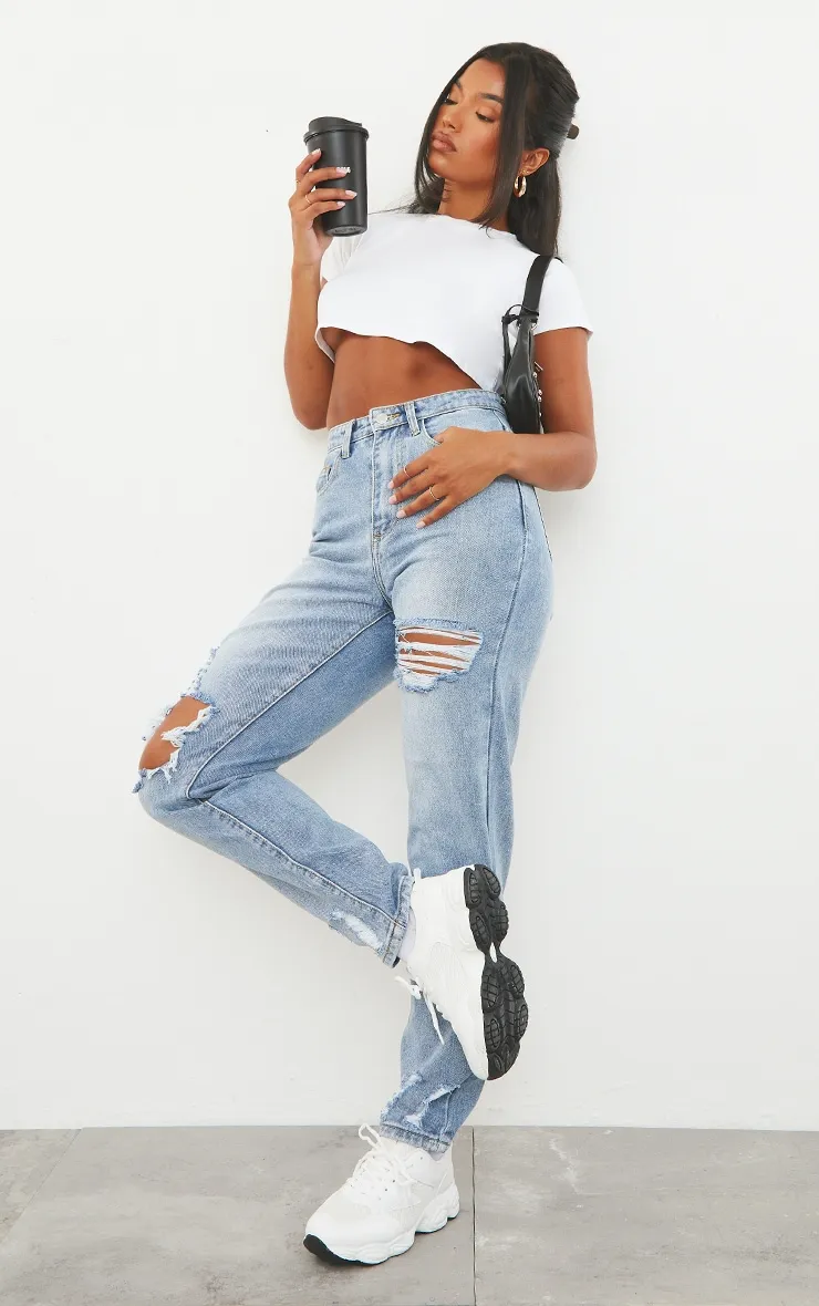 PRETTYLITTLETHING Light Blue Wash Open Knee Ripped Hem Mom Jeans sold by Pretty Little Thing