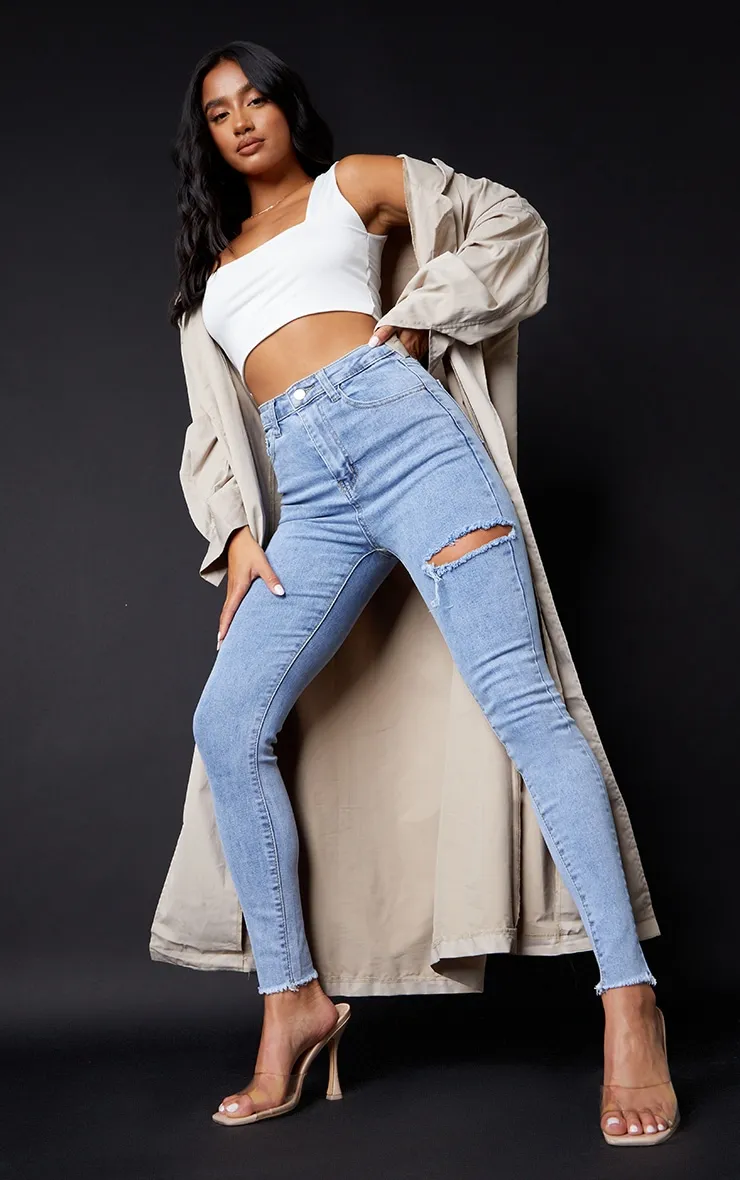 PRETTYLITTLETHING Petite Vintage Wash Thigh Rip Raw Hem 5 Pocket Skinny Jeans sold by Pretty Little Thing