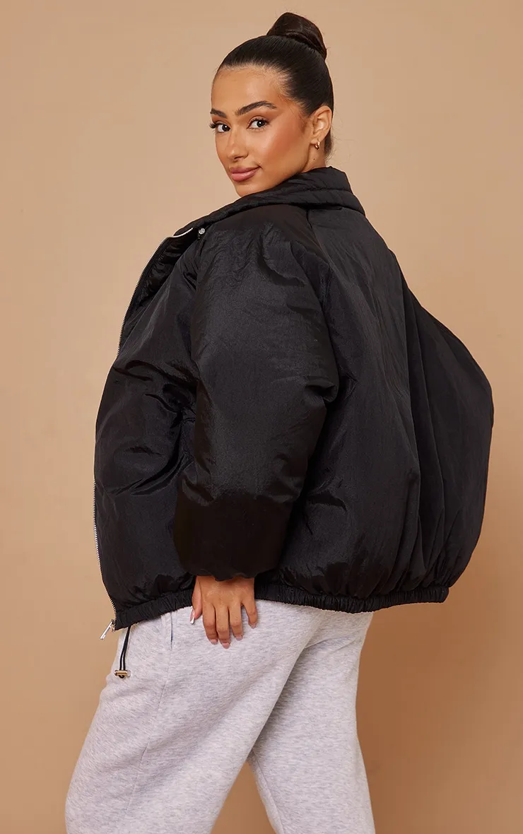 Petite Black Extreme Oversized Puffer Jacket sold by Pretty Little Thing product image thumbnail 2