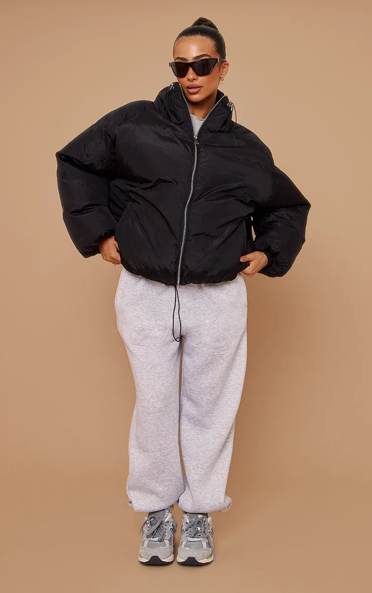 Petite Black Extreme Oversized Puffer Jacket sold by Pretty Little Thing product image thumbnail 3