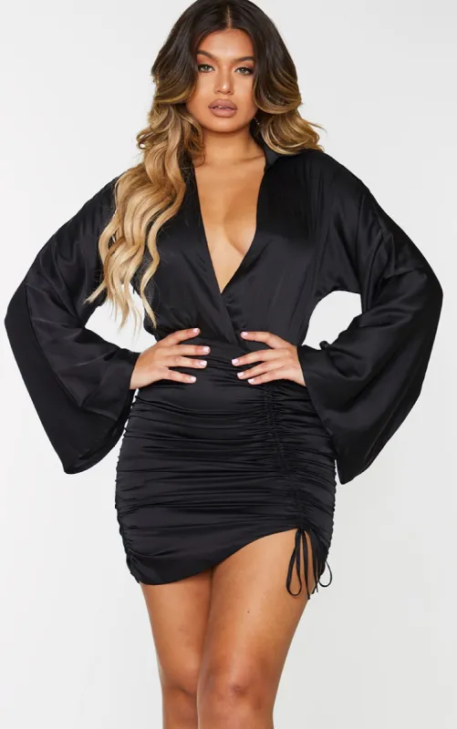 Black Satin Ruched Skirt Flared Sleeve Bodycon Dress sold by Pretty Little Thing