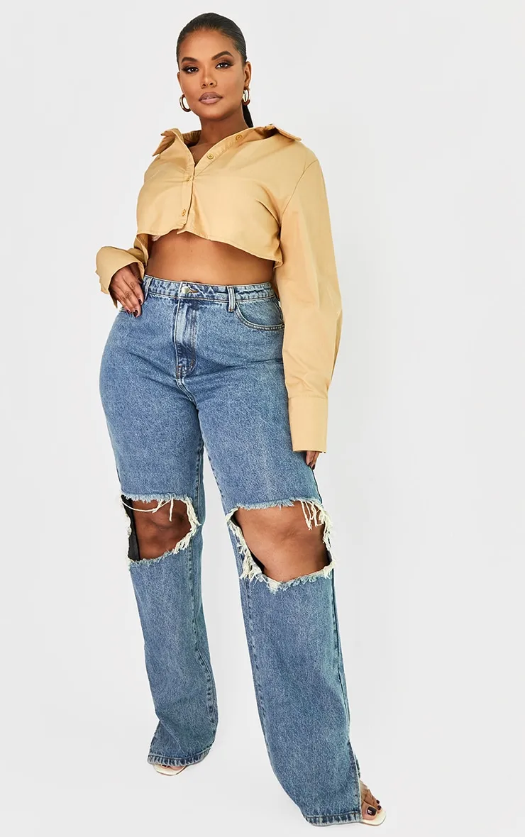 Plus Vintage Wash Ripped Knee Split Hem Jeans sold by Pretty Little Thing