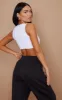 Basic White Cotton Blend Sleeveless Elastic Hem Crop Top sold by Pretty Little Thing
