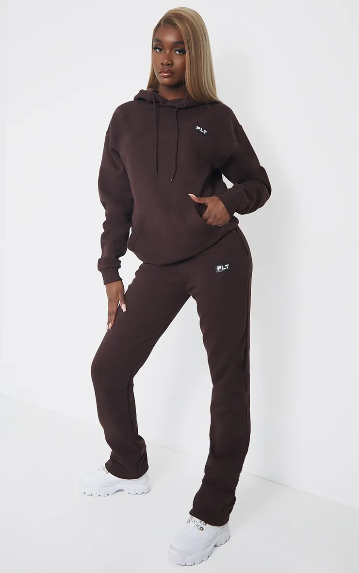 PRETTYLITTLETHING Tall Chocolate Badge Detail Straight Leg Joggers sold by Pretty Little Thing