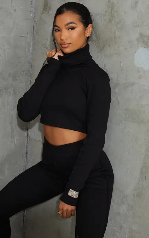 PRETTYLITTLETHING Black Badge Structured Rib High Neck Long Sleeve Crop Top sold by Pretty Little Thing