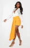 Orange Ruched Drape Front Mini Skirt sold by Pretty Little Thing