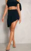 Black Slinky Asymmetrical Micro Mini Skirt sold by Pretty Little Thing