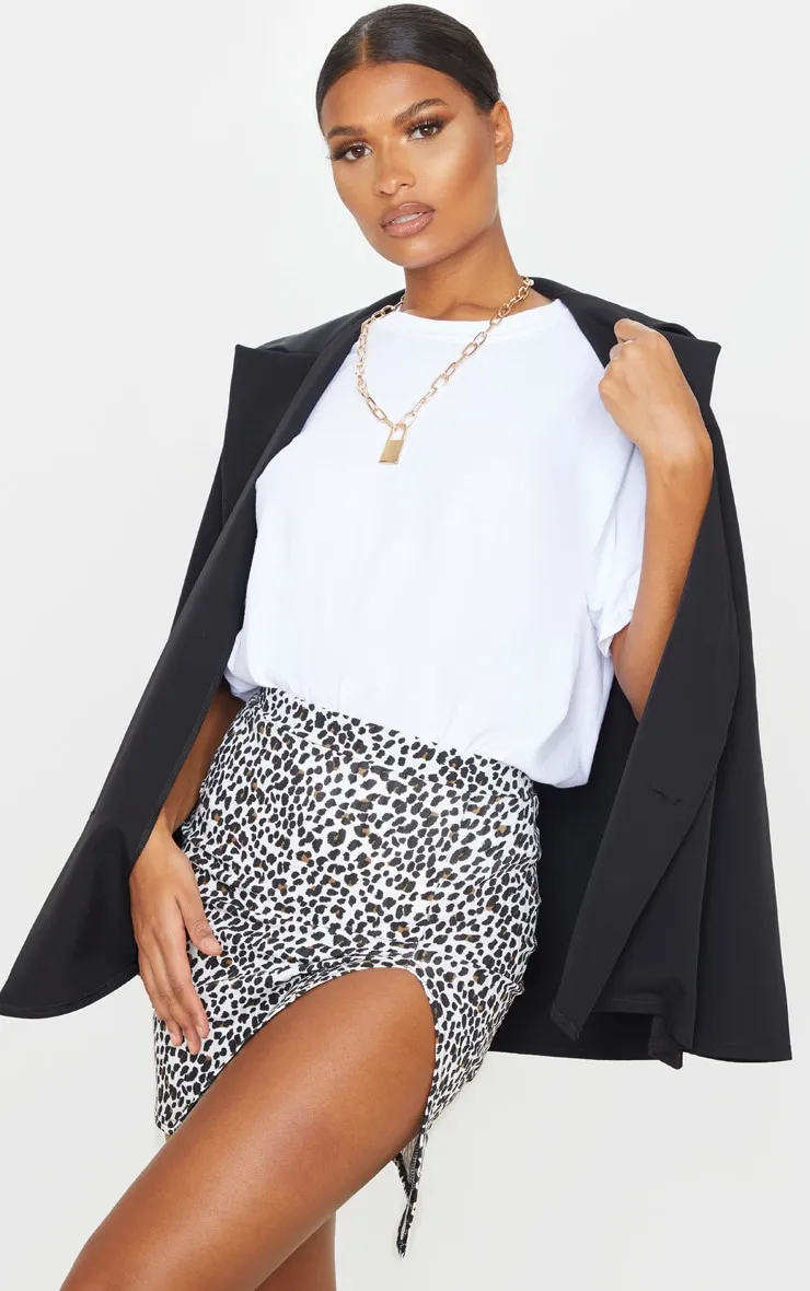 White Leopard Print Rib Split Front Mini Skirt sold by Pretty Little Thing