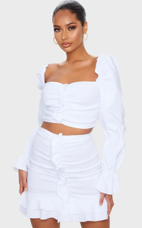 White Woven Stretch Frill Ruched Front Mini Skirt sold by Pretty Little Thing