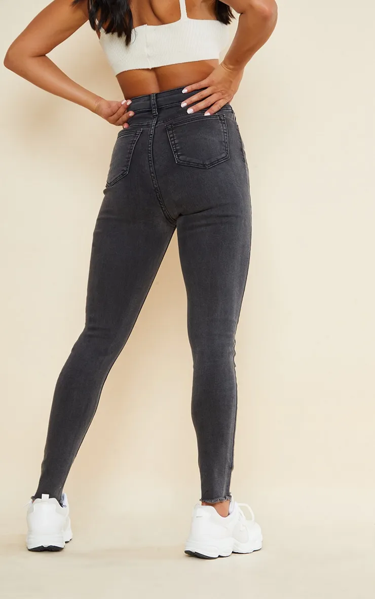 PRETTYLITTLETHING Petite Washed Black Thigh Rip Raw Hem 5 Pocket Skinny Jeans sold by Pretty Little Thing product image thumbnail 3
