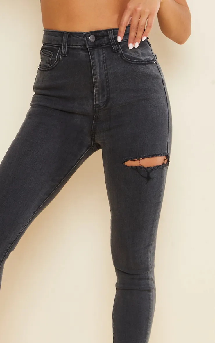 PRETTYLITTLETHING Petite Washed Black Thigh Rip Raw Hem 5 Pocket Skinny Jeans sold by Pretty Little Thing product image thumbnail 4