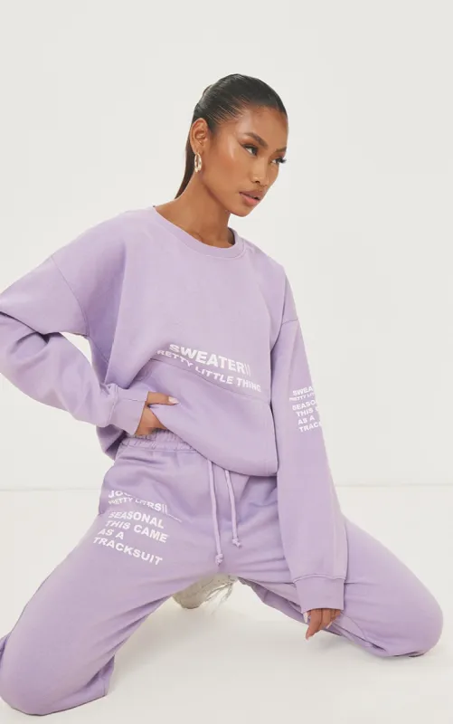 PRETTYLITTLETHING Purple Oversized Slogan Print Pocket Front Sweater sold by Pretty Little Thing