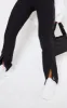 Black Woven Straight Leg Split Hem Trousers sold by Pretty Little Thing