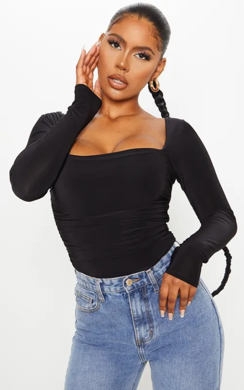 Black Slinky Ruched Long Sleeve Square Neck Bodysuit sold by Pretty Little Thing